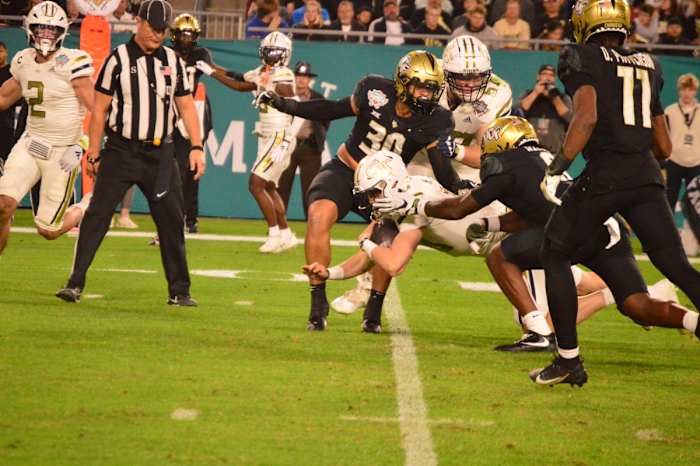 Haynes King being tackled by UCF
